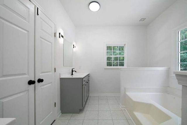 1460 Bakers Bridge Rd, Douglasville, GA 30134 - bathroom with vanity, a bath, baseboards, and tile patterned floors