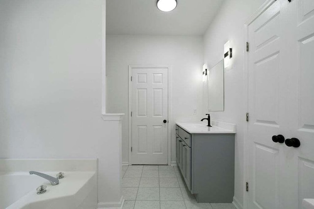 1460 Bakers Bridge Rd, Douglasville, GA 30134 - full bathroom featuring vanity, a garden tub, and tile patterned floors