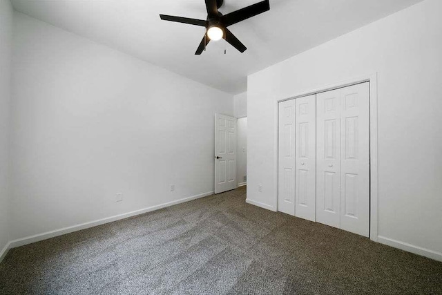 1460 Bakers Bridge Rd, Douglasville, GA 30134 - unfurnished bedroom featuring carpet, baseboards, a closet, and ceiling fan
