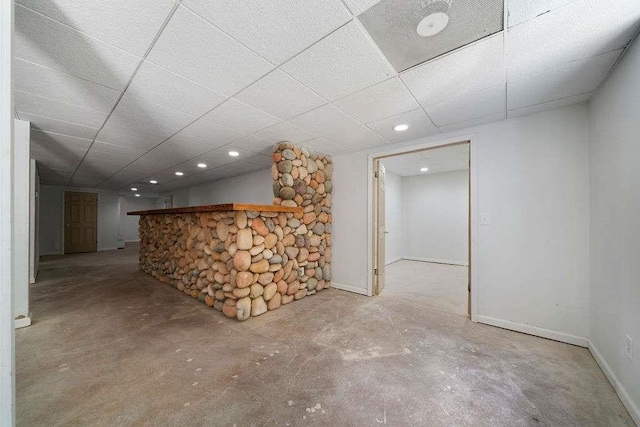 1460 Bakers Bridge Rd, Douglasville, GA 30134 - below grade area with baseboards, a paneled ceiling, and recessed lighting