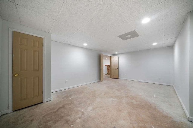 1460 Bakers Bridge Rd, Douglasville, GA 30134 - spare room with concrete flooring, baseboards, a drop ceiling, and recessed lighting