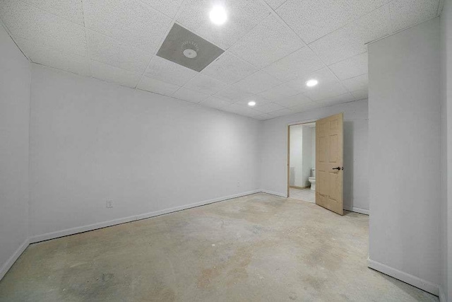 1460 Bakers Bridge Rd, Douglasville, GA 30134 - empty room featuring unfinished concrete floors, baseboards, recessed lighting, and a drop ceiling
