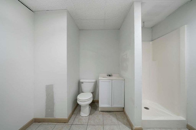 1460 Bakers Bridge Rd, Douglasville, GA 30134 - bathroom featuring toilet, a stall shower, baseboards, tile patterned floors, and vanity