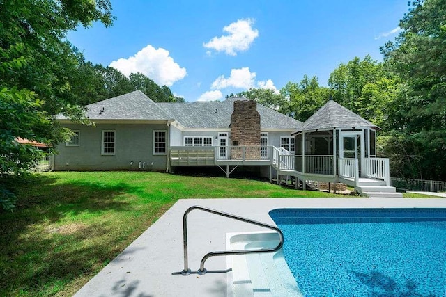 1460 Bakers Bridge Rd, Douglasville, GA 30134 - swimming pool featuring a gazebo, a wooden deck, a lawn, and a patio