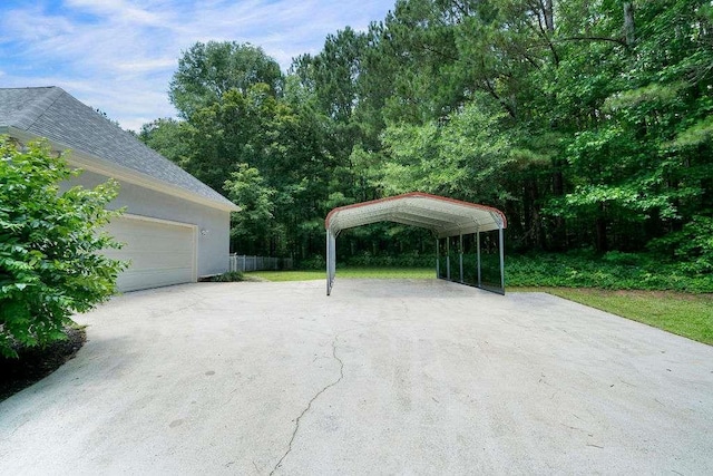 1460 Bakers Bridge Rd, Douglasville, GA 30134 - garage featuring driveway and a detached carport