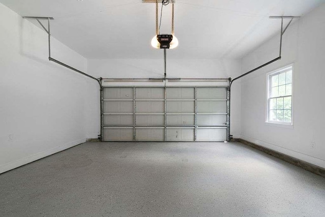 1460 Bakers Bridge Rd, Douglasville, GA 30134 - garage with a garage door opener and baseboards