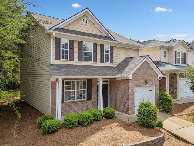 181 Ridgemont Rd, Canton, GA 30114 - view of front of property featuring brick siding, a garage, and roof with shingles