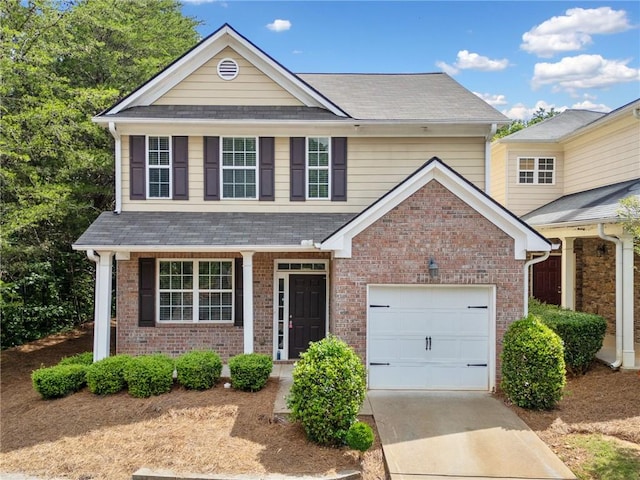181 Ridgemont Rd, Canton, GA 30114 - traditional home with a garage, concrete driveway, a shingled roof, and brick siding