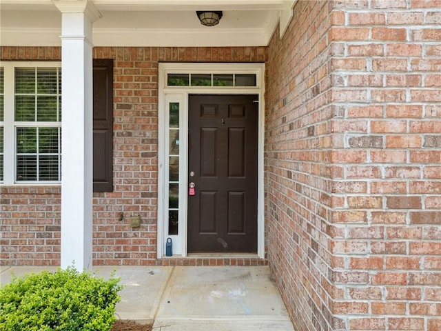 181 Ridgemont Rd, Canton, GA 30114 - view of exterior entry featuring brick siding and a porch