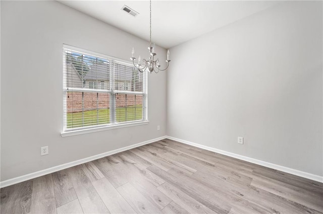 181 Ridgemont Rd, Canton, GA 30114 - empty room with a chandelier, wood finished floors, and baseboards