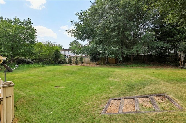 view of yard featuring a garden and fence