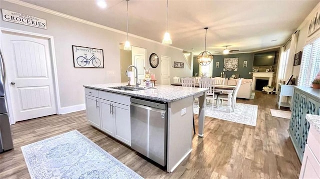 109 Red Fox Dr, Dallas, GA 30157 - kitchen with dishwasher, a fireplace, dark wood-style floors, ceiling fan, and ornamental molding