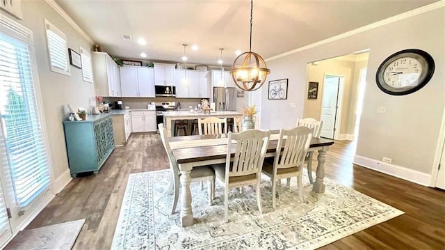 109 Red Fox Dr, Dallas, GA 30157 - dining space with crown molding, a chandelier, dark wood-style floors, and recessed lighting