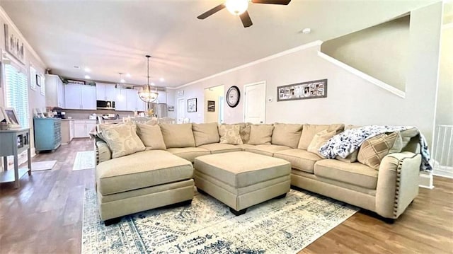 109 Red Fox Dr, Dallas, GA 30157 - living room with wood finished floors, ceiling fan, ornamental molding, recessed lighting, and a chandelier