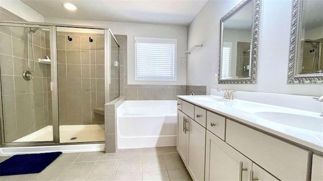 109 Red Fox Dr, Dallas, GA 30157 - full bath featuring a bath, tile patterned floors, a shower stall, double vanity, and recessed lighting