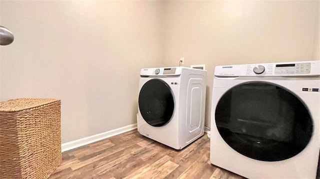 109 Red Fox Dr, Dallas, GA 30157 - washroom with washing machine and clothes dryer and light wood-style floors