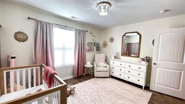 109 Red Fox Dr, Dallas, GA 30157 - bedroom featuring a nursery area and wood finished floors