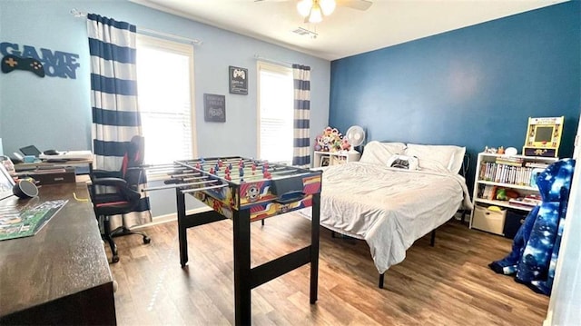 109 Red Fox Dr, Dallas, GA 30157 - bedroom with wood finished floors, a desk, and a ceiling fan