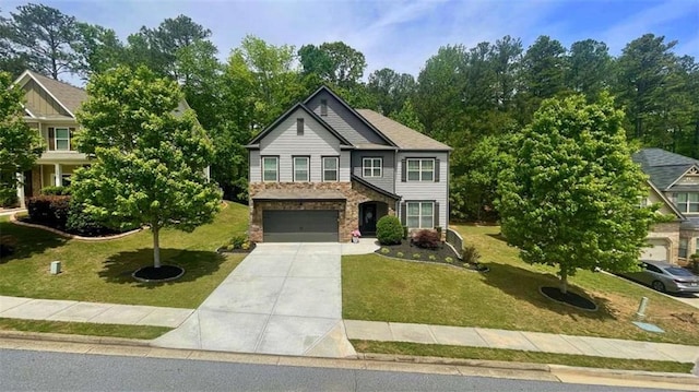 109 Red Fox Dr, Dallas, GA 30157 - view of front of house with concrete driveway, a garage, a front yard, and stone siding