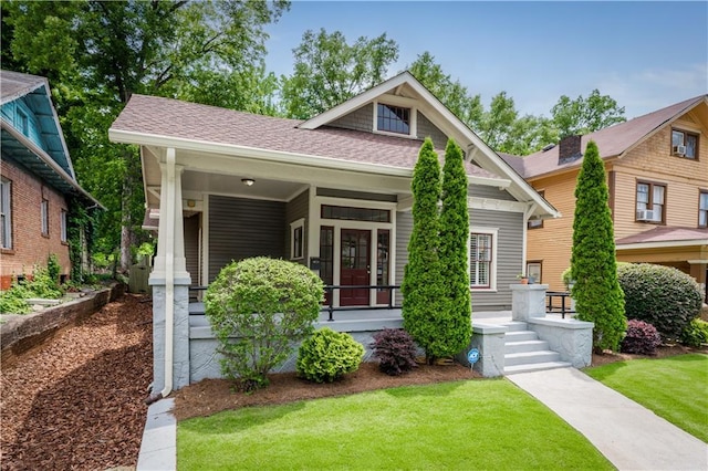 1232 Lucile Ave SW, Atlanta, GA 30310 - view of front of house featuring a porch, a front yard, and roof with shingles