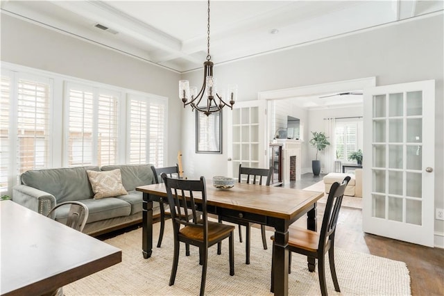 1232 Lucile Ave SW, Atlanta, GA 30310 - dining room featuring a chandelier, beam ceiling, coffered ceiling, light wood finished floors, and french doors