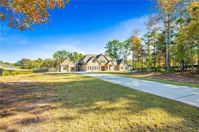 view of front of home with a front yard and a residential view