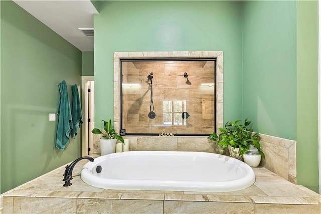 full bath featuring visible vents, tiled shower, and a bath