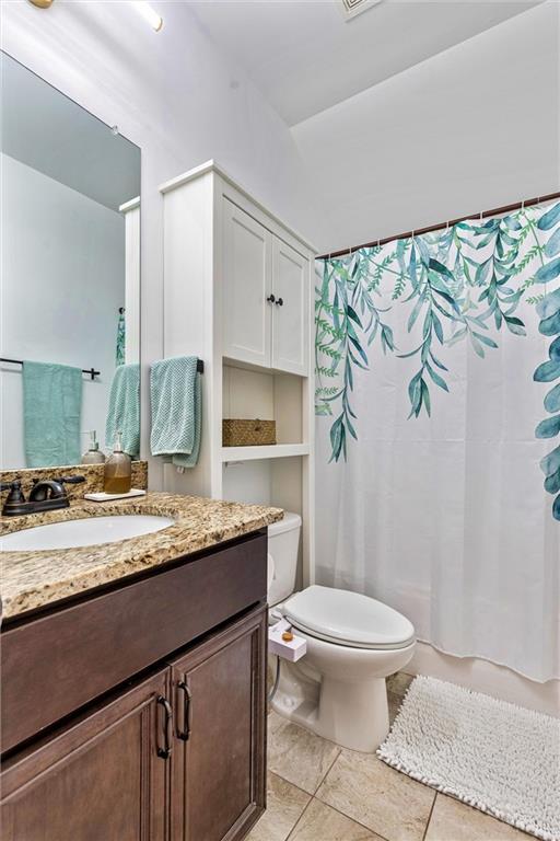 bathroom with toilet and vanity