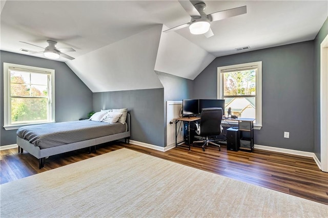 bedroom featuring dark wood-type flooring, multiple windows, and visible vents