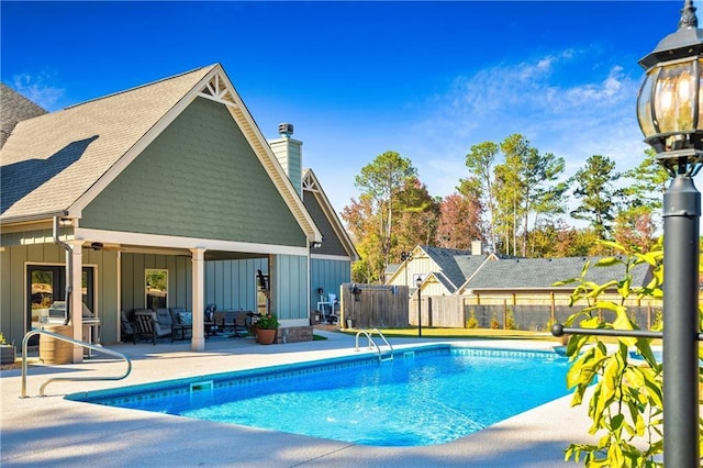 view of pool with a patio area, fence, and a fenced in pool