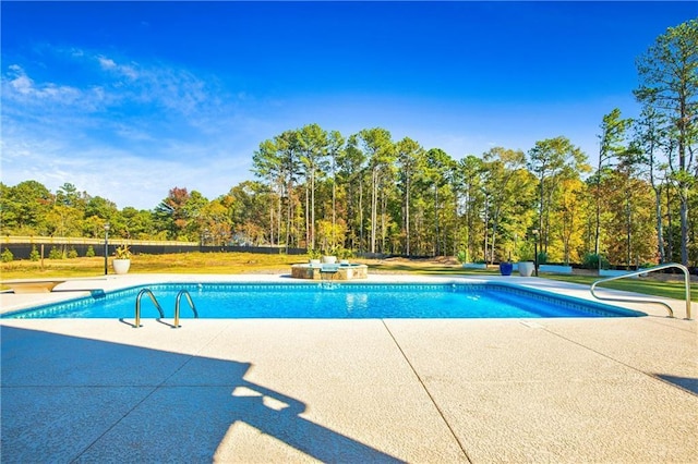 outdoor pool featuring a patio