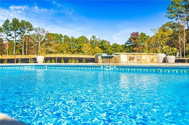 view of swimming pool featuring a fenced in pool