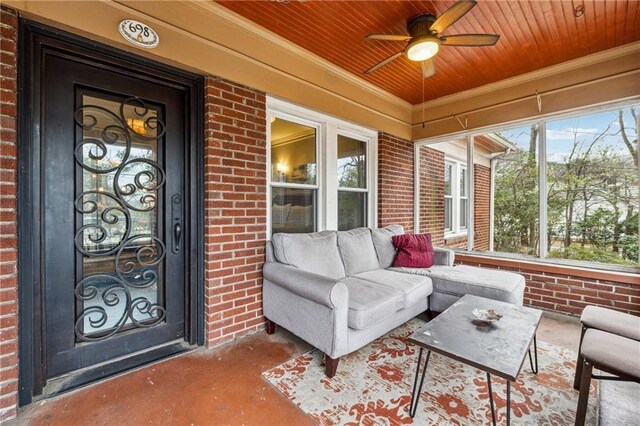 698 Bellemeade Ave NW, Atlanta, GA 30318 - view of exterior entry with brick siding, a ceiling fan, and an outdoor living space