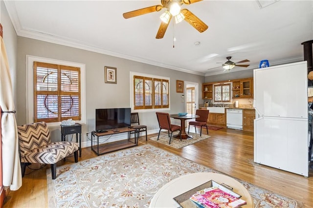 698 Bellemeade Ave NW, Atlanta, GA 30318 - living room featuring a ceiling fan, wood finished floors, crown molding, and baseboards