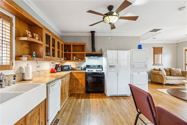 698 Bellemeade Ave NW, Atlanta, GA 30318 - kitchen with open shelves, white appliances, stacked washer / drying machine, brown cabinets, and a ceiling fan