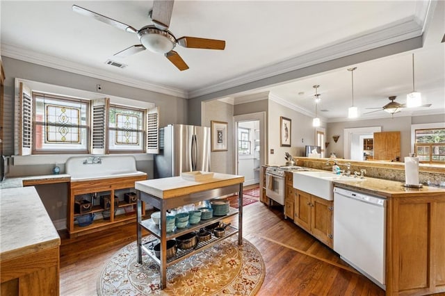 698 Bellemeade Ave NW, Atlanta, GA 30318 - kitchen with white dishwasher, a ceiling fan, freestanding refrigerator, a sink, and wood finished floors