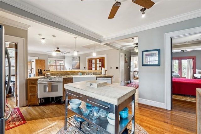 698 Bellemeade Ave NW, Atlanta, GA 30318 - dining room with ceiling fan, ornamental molding, light wood finished floors, healthy amount of natural light, and baseboards