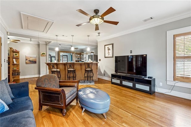 698 Bellemeade Ave NW, Atlanta, GA 30318 - living area featuring attic access, ceiling fan, light wood-style floors, crown molding, and baseboards