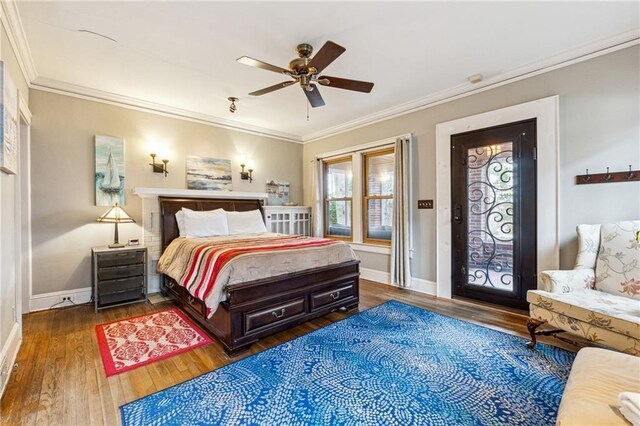 698 Bellemeade Ave NW, Atlanta, GA 30318 - bedroom with wood finished floors, crown molding, baseboards, and ceiling fan