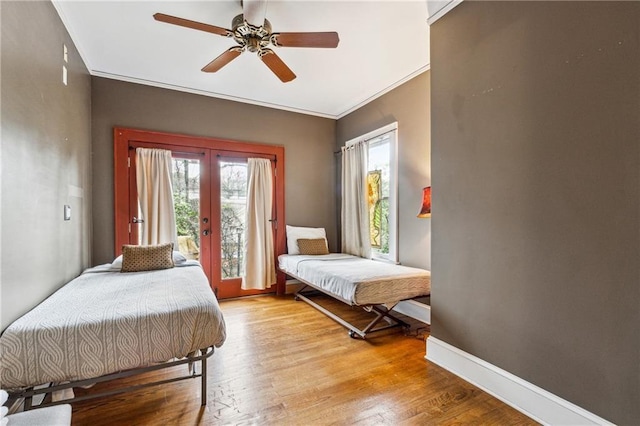 698 Bellemeade Ave NW, Atlanta, GA 30318 - bedroom with french doors, access to outside, baseboards, wood finished floors, and crown molding