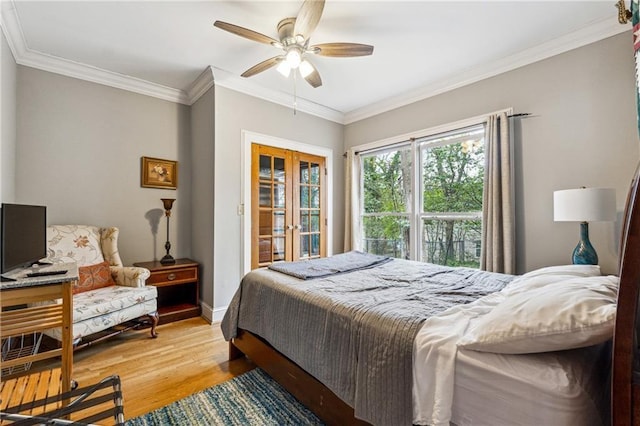 698 Bellemeade Ave NW, Atlanta, GA 30318 - bedroom with light wood-style flooring, crown molding, baseboards, a ceiling fan, and french doors