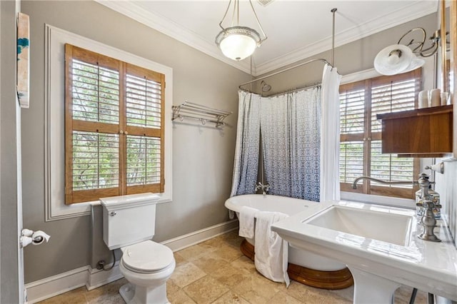 698 Bellemeade Ave NW, Atlanta, GA 30318 - bathroom with baseboards, toilet, a freestanding tub, ornamental molding, and a shower with shower curtain
