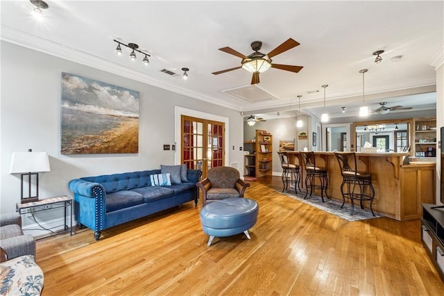 698 Bellemeade Ave NW, Atlanta, GA 30318 - living area featuring a ceiling fan, ornamental molding, light wood-type flooring, and french doors