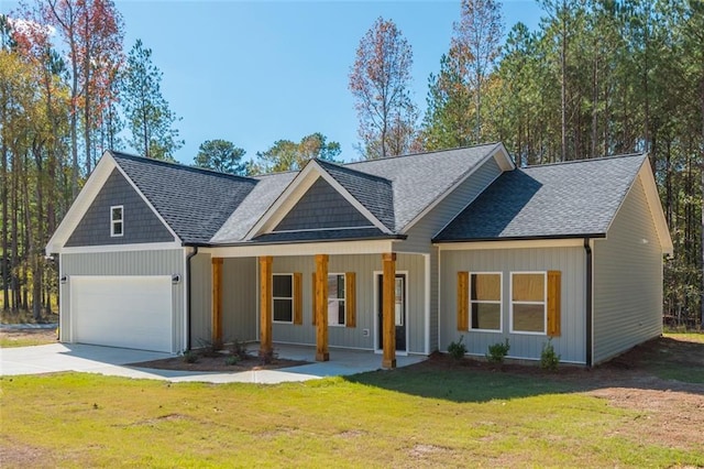 view of front facade with a front lawn, a porch, concrete driveway, roof with shingles, and an attached garage