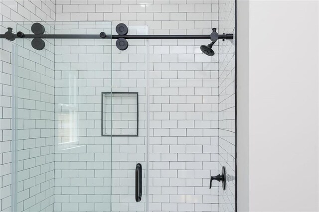 room details featuring a shower stall