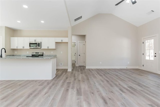 kitchen with white cabinetry, light wood-style floors, visible vents, and appliances with stainless steel finishes