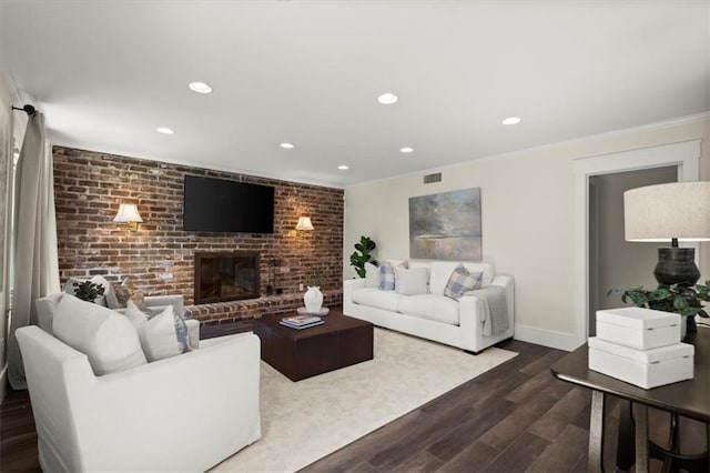 living room featuring dark wood finished floors, a fireplace, recessed lighting, visible vents, and baseboards