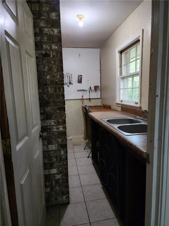 bathroom with sink and tile patterned flooring