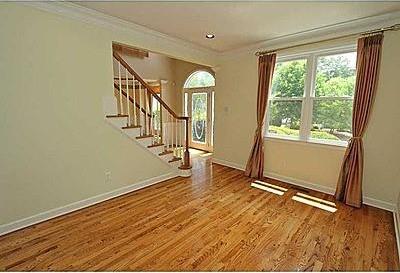 spare room featuring hardwood / wood-style flooring and crown molding