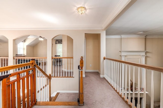 corridor with light carpet and crown molding